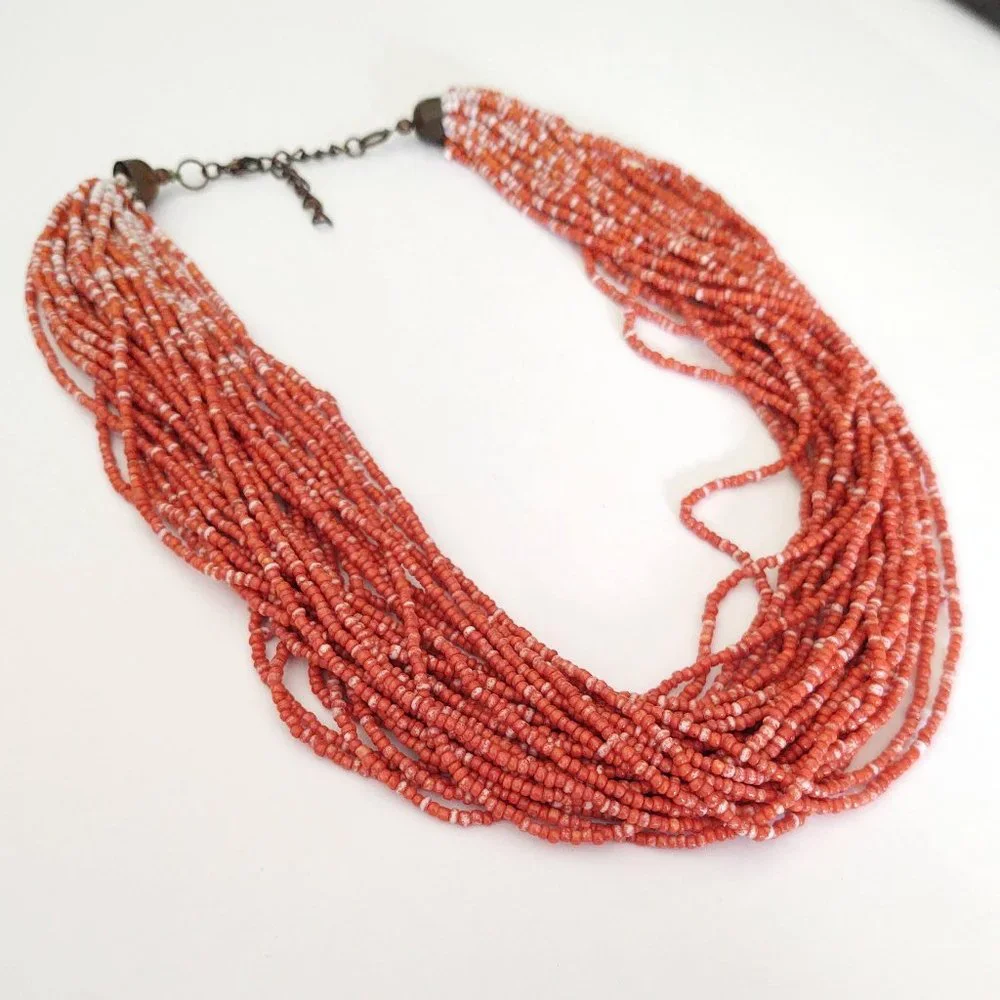 Orange and white multi strand seed bead necklace